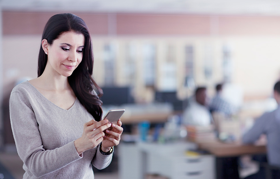 Woman Looking at a debit card alert on phone